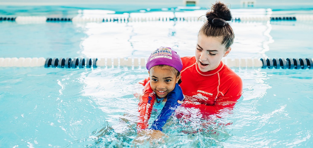 Swim instructor teaching a private swimming lessons