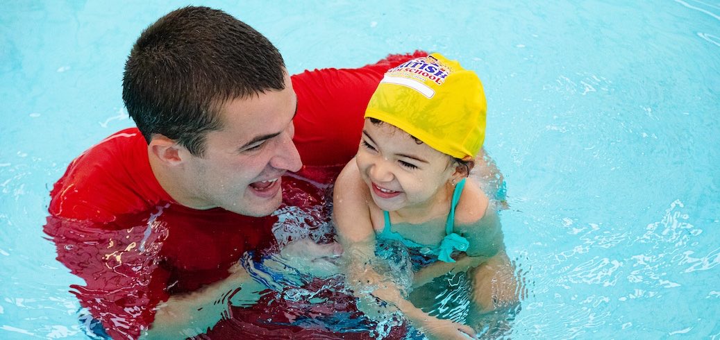 Student and instructor in pool during private swimming lessons in Montgomery County