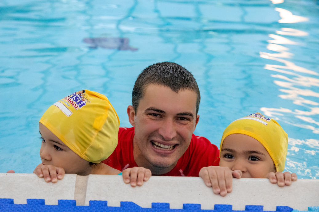Swim instructor teaching a swimming class