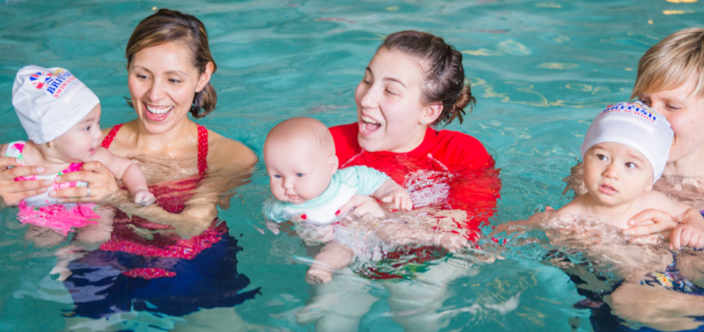 Families participating in parent-assissted baby swim classes