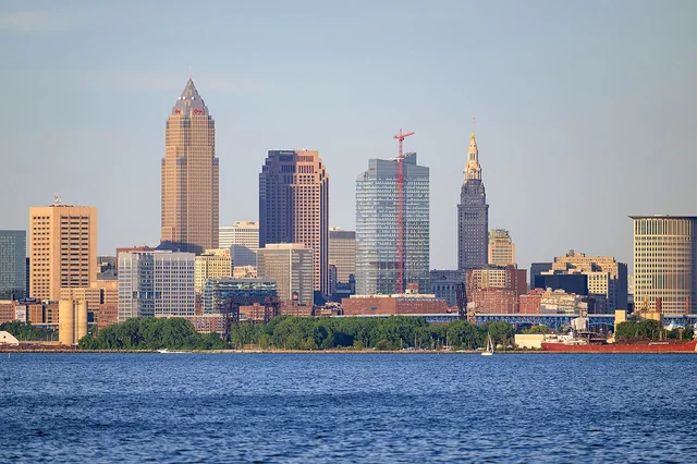 Cleveland's iconic skyline featuring Key Tower and Terminal Tower across Lake Erie. TITLE