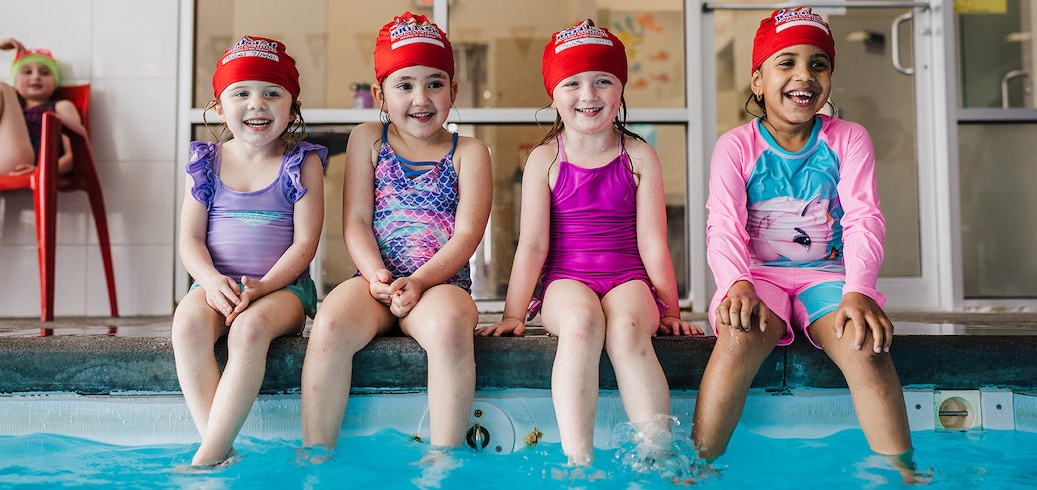 Children participating in a swimming class for kids