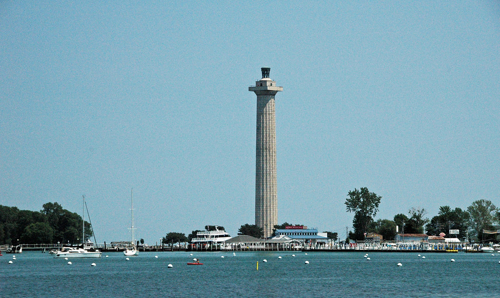 Perry's Victory and International Peace Memorial towers over a vibrant waterfront with boats and