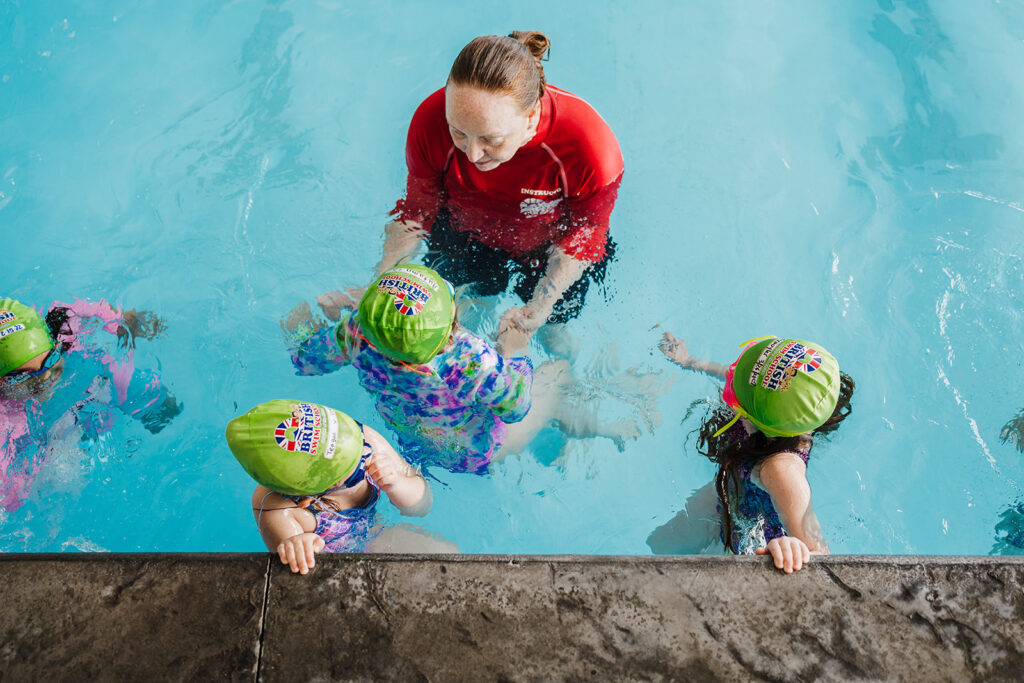 Young swimmers enjoying a year-round swim lesson with British Swim School of Montgomery County PA.