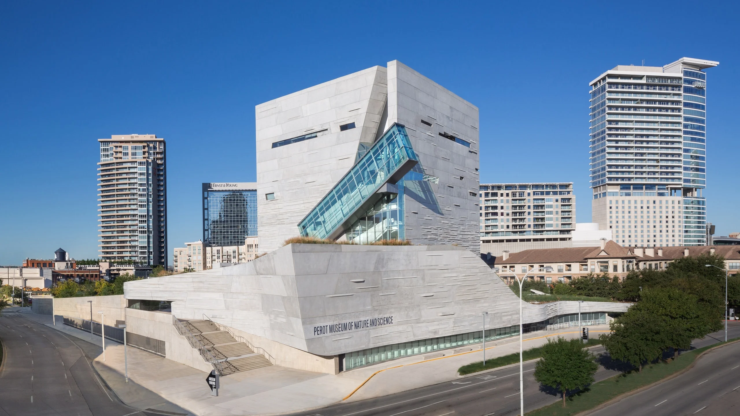The modern Perot Museum of Nature and Science features a textured concrete facade and a